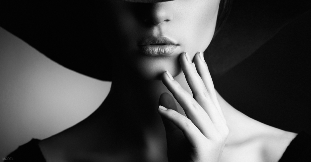 Black and white close-up photo of a woman's face.