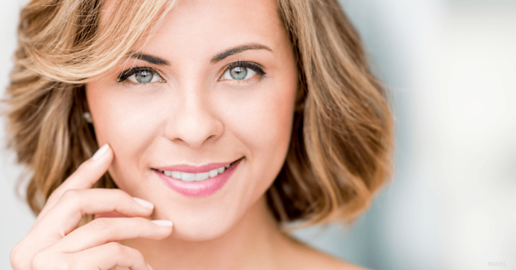 Portrait of a woman who has recovered from eyelid surgery.