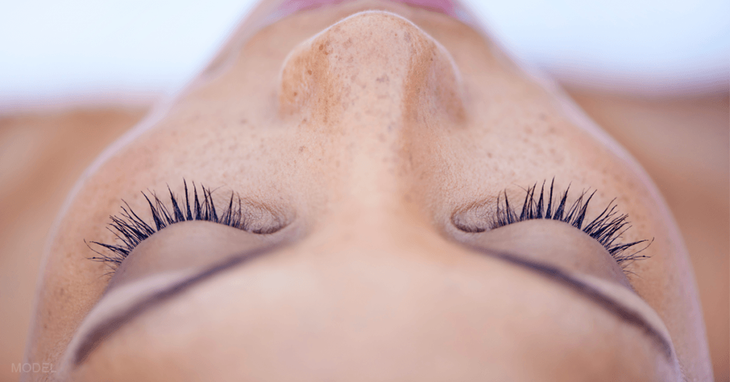 Close up of a woman's closed eyes.