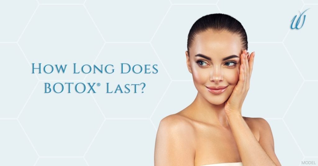Woman smiling with hands on her face. (MODEL)